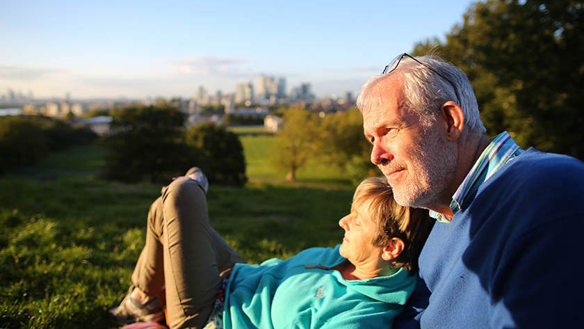 3431_Older couple in park with London in background-Aviva_image