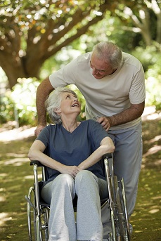 older couple with woman in wheelchair